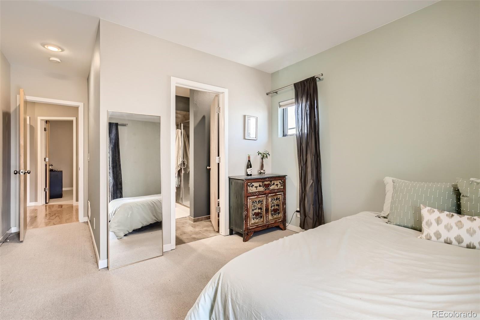 826 25th Street Denver, CO 80205 - Photo 14 of 23 a bedroom with a bed and a mirror