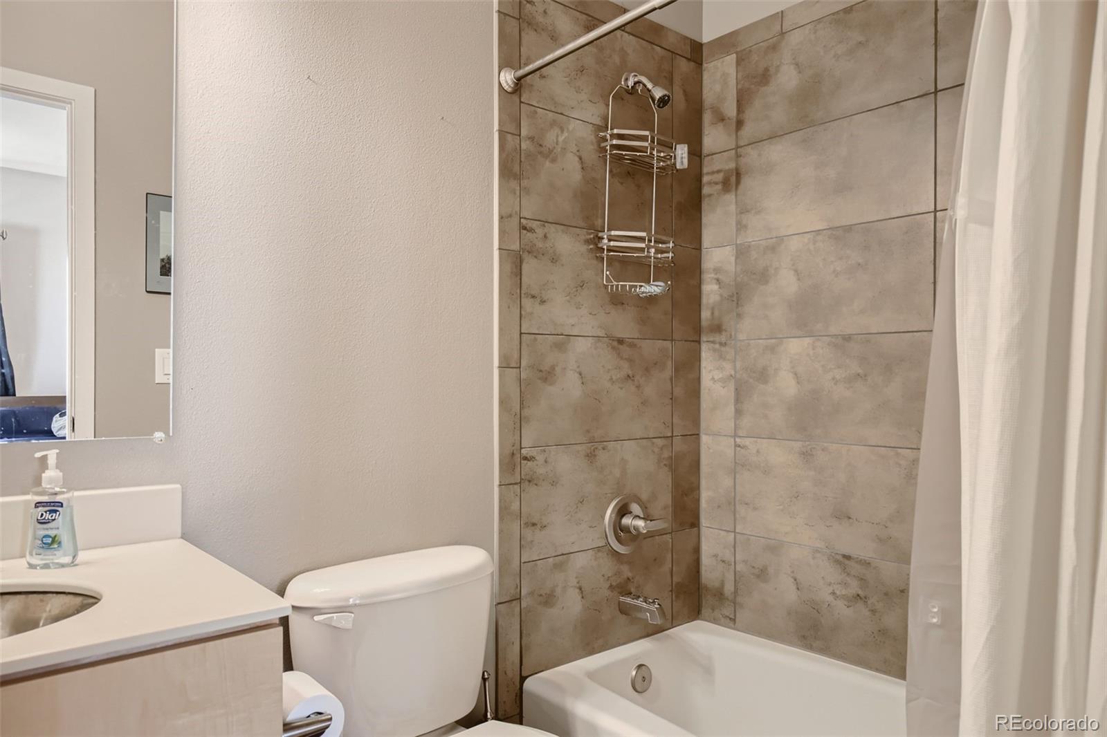 826 25th Street Denver, CO 80205 - Photo 18 of 23 a bathroom with a toilet and shower