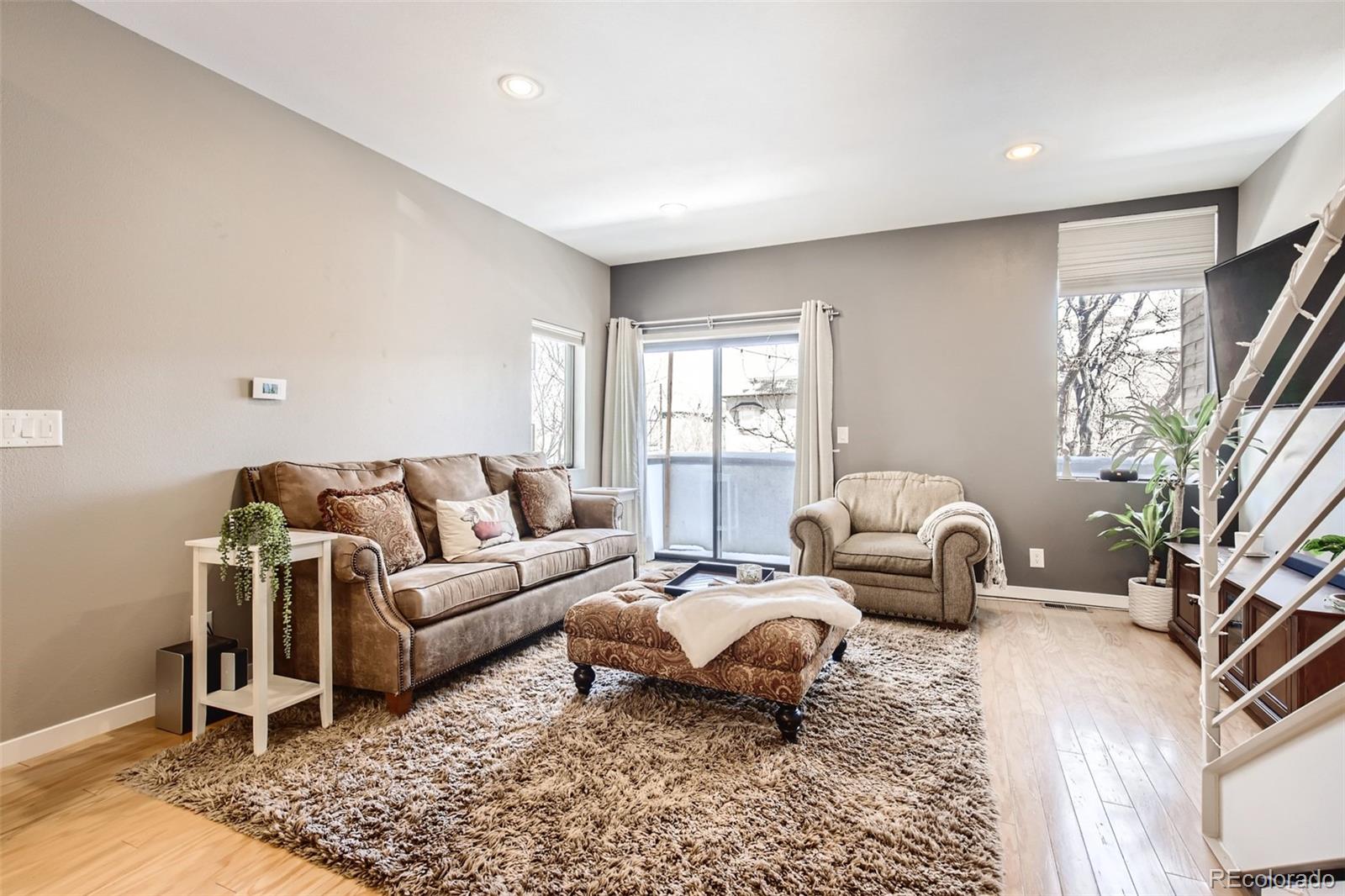 826 25th Street Denver, CO 80205 - Photo 6 of 23 a living room with furniture window and a table