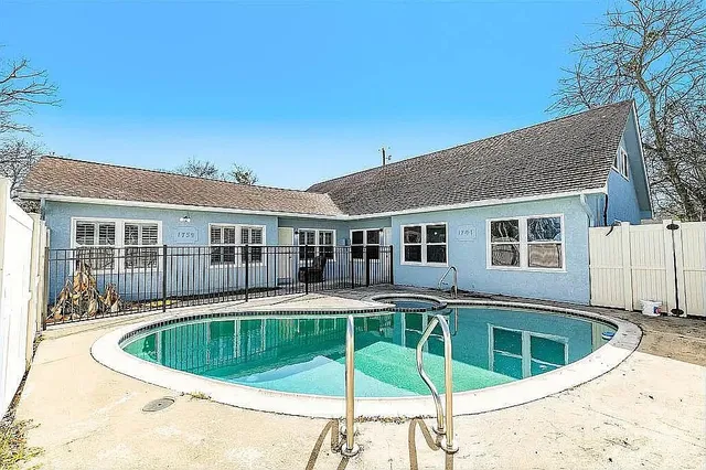 a view of a house with a swimming pool