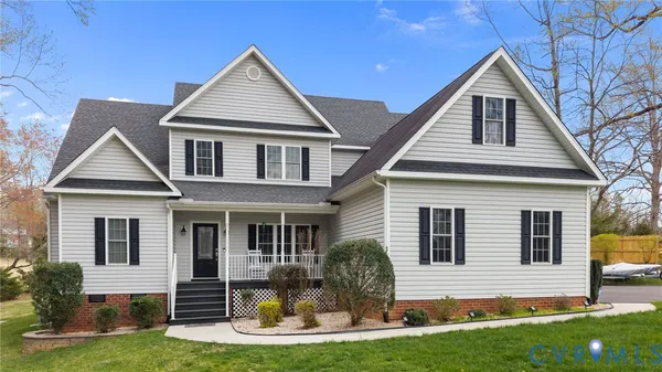 a front view of a house with yard