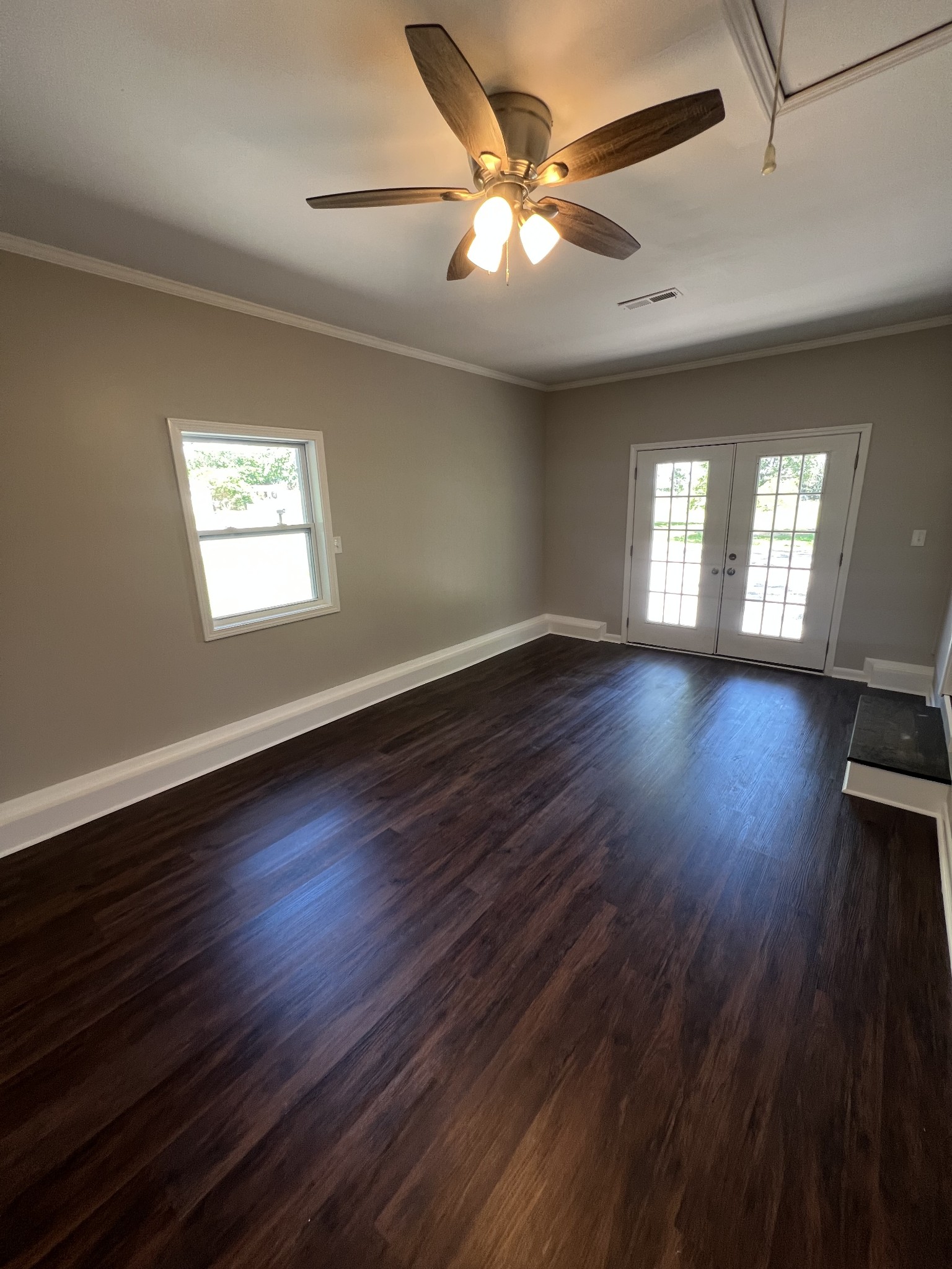 1846 Patrick Road Pulaski, TN 38478 - Photo 14 of 26 a view of an empty room with wooden floor and a window