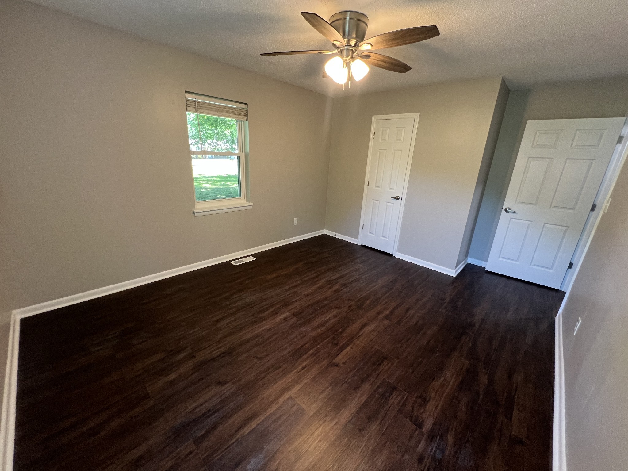 1846 Patrick Road Pulaski, TN 38478 - Photo 16 of 26 a view of empty room with wooden floor and fan