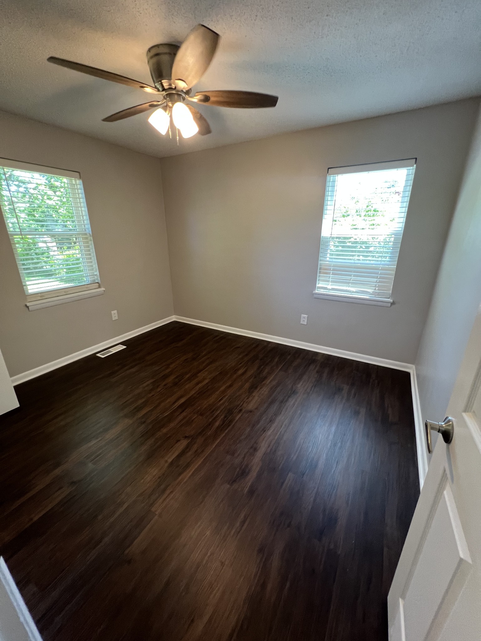 1846 Patrick Road Pulaski, TN 38478 - Photo 20 of 26 a view of an empty room with wooden floor and a window