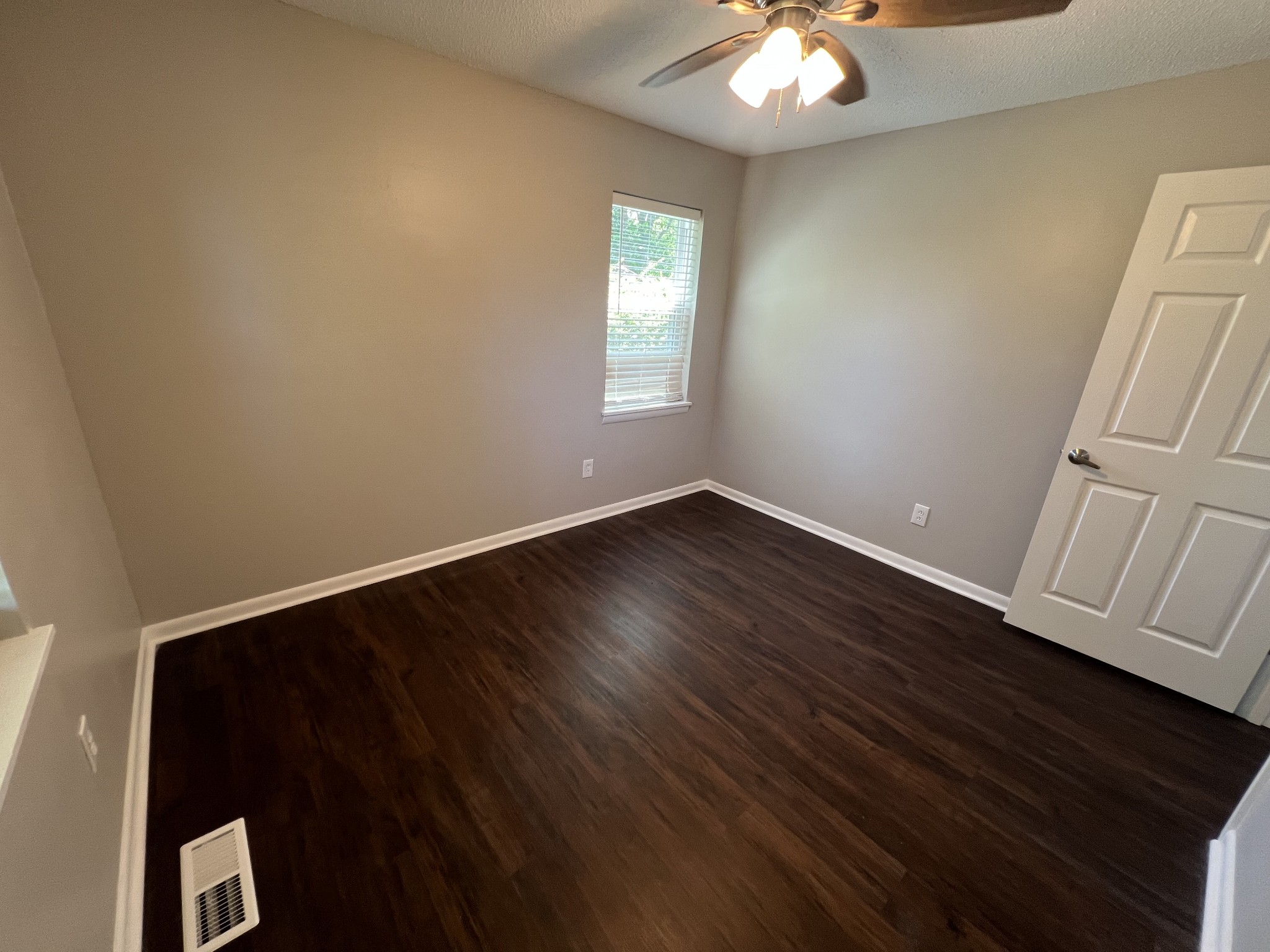 1846 Patrick Road Pulaski, TN 38478 - Photo 21 of 26 an empty room with wooden floor and windows
