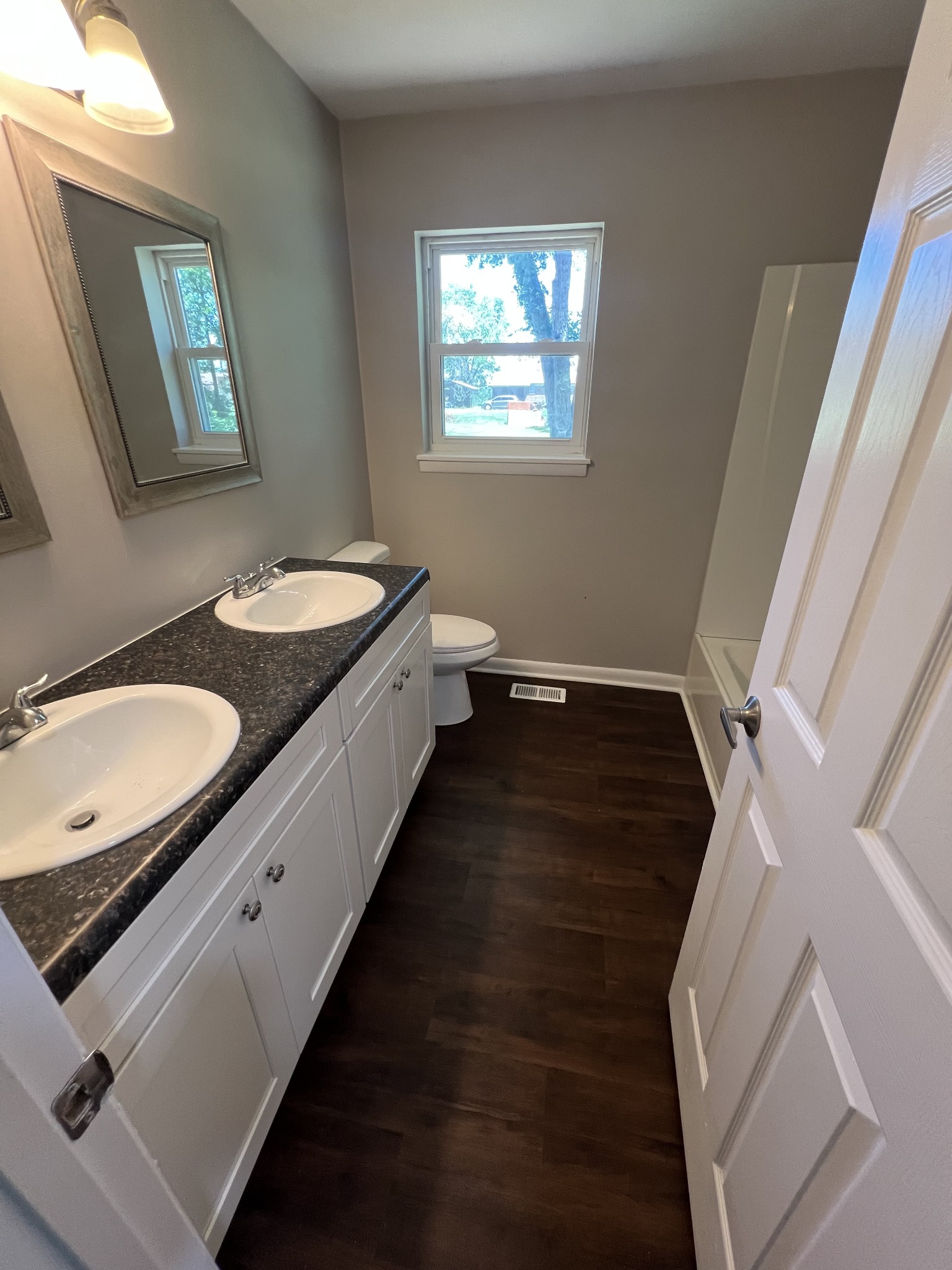 1846 Patrick Road Pulaski, TN 38478 - Photo 23 of 26 a bathroom with double vanity sink and mirror