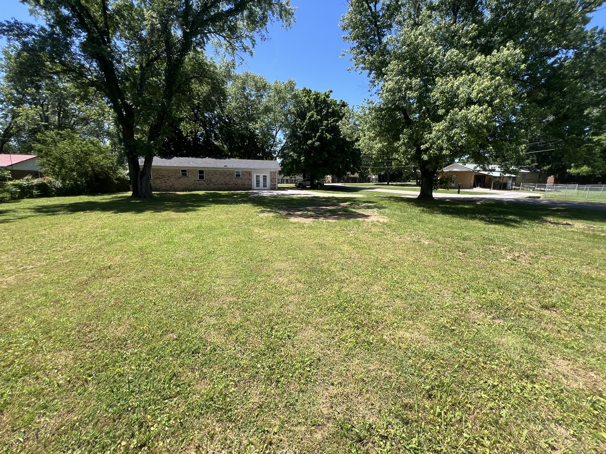 1846 Patrick Road Pulaski, TN 38478 - Photo 3 of 26 a view of a swimming pool with a bench