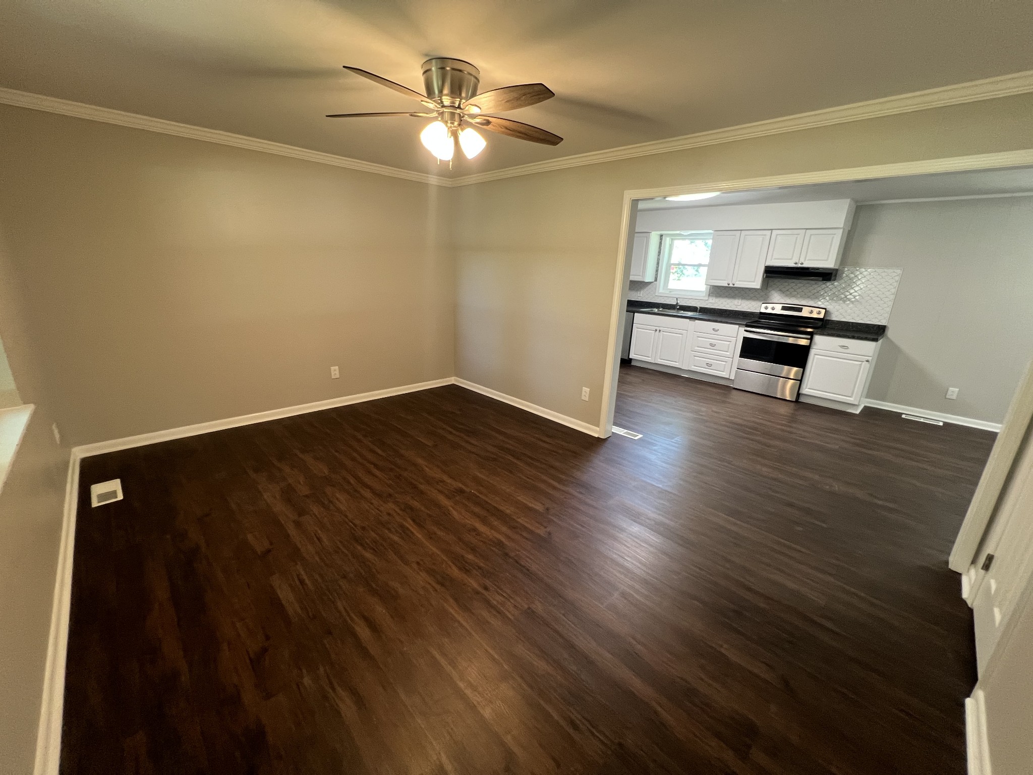1846 Patrick Road Pulaski, TN 38478 - Photo 4 of 26 wooden floor in an empty room with a window