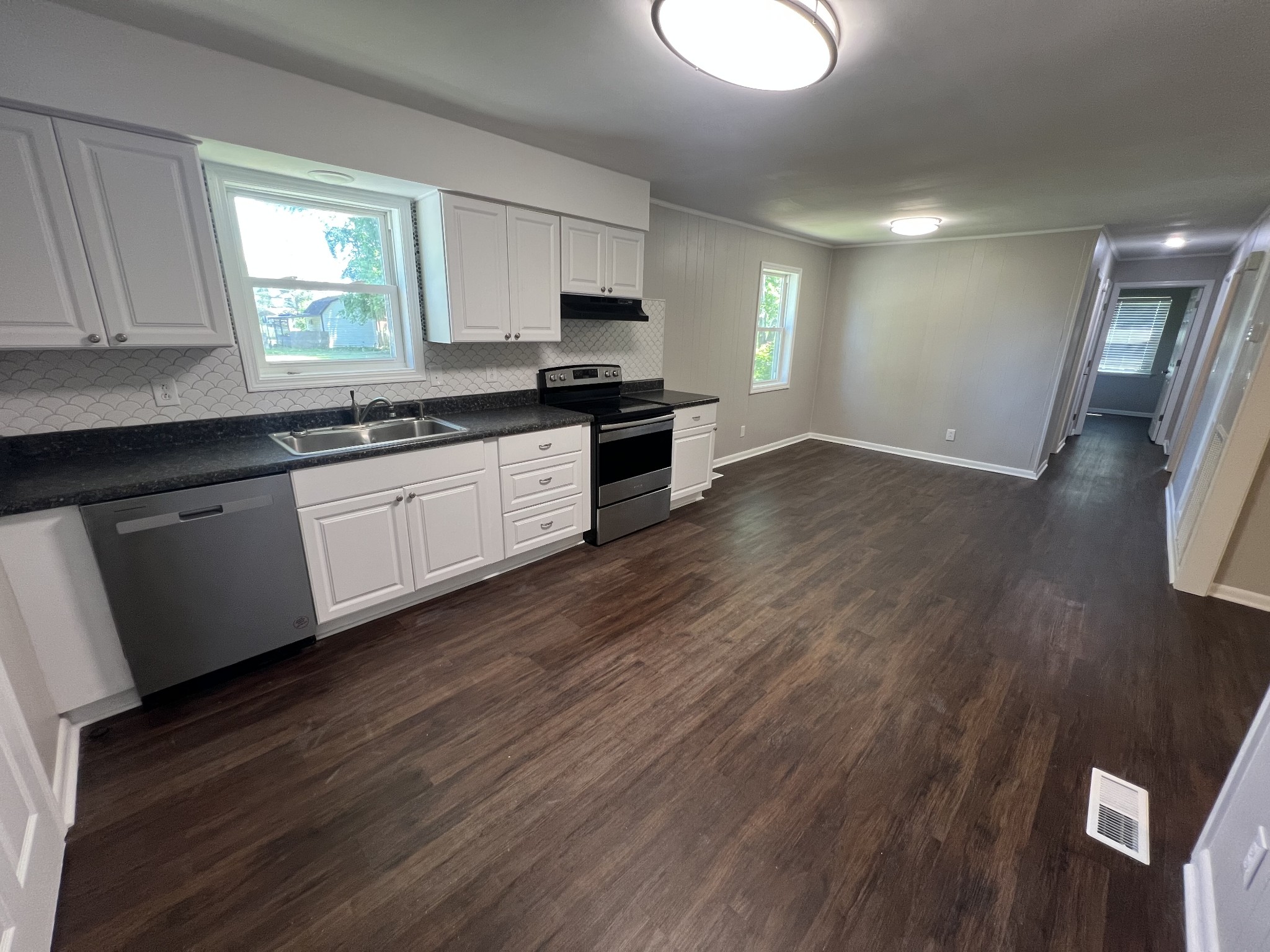 1846 Patrick Road Pulaski, TN 38478 - Photo 8 of 26 a kitchen with granite countertop a stove a sink and a refrigerator