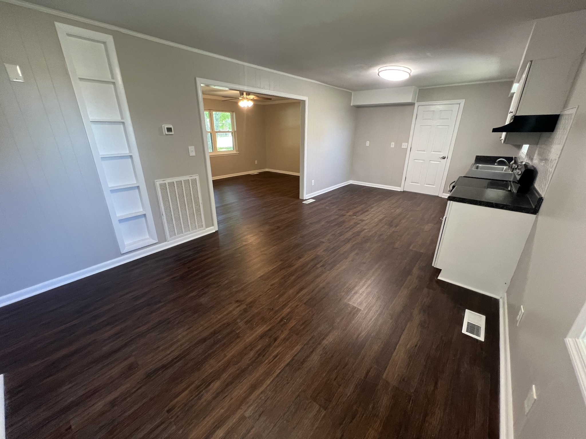 1846 Patrick Road Pulaski, TN 38478 - Photo 9 of 26 wooden floor in an empty room with a window