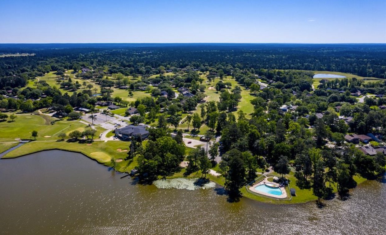 7 Hogan Lane Huntsville, TX 77340 - Photo 17 of 21 a view of a houses with a yard