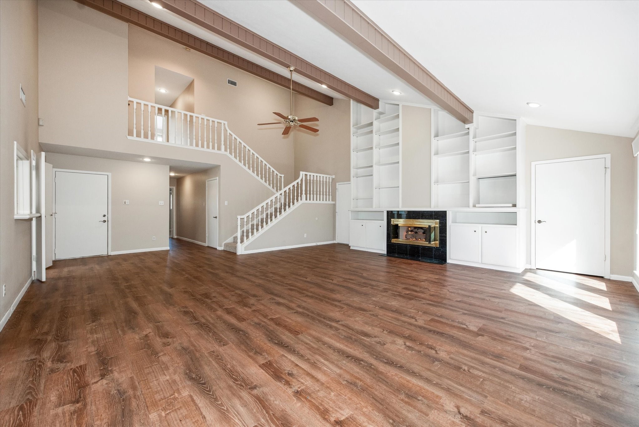7 Hogan Lane Huntsville, TX 77340 - Photo 2 of 21 a view of empty room with wooden floor