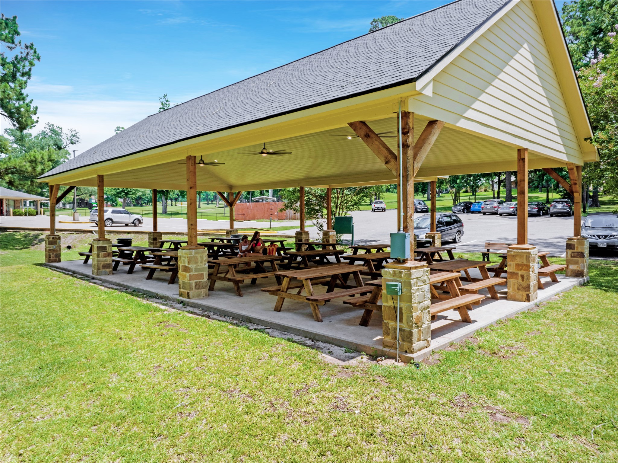 7 Hogan Lane Huntsville, TX 77340 - Photo 21 of 21 a view of a patio with a table and chairs under an umbrella