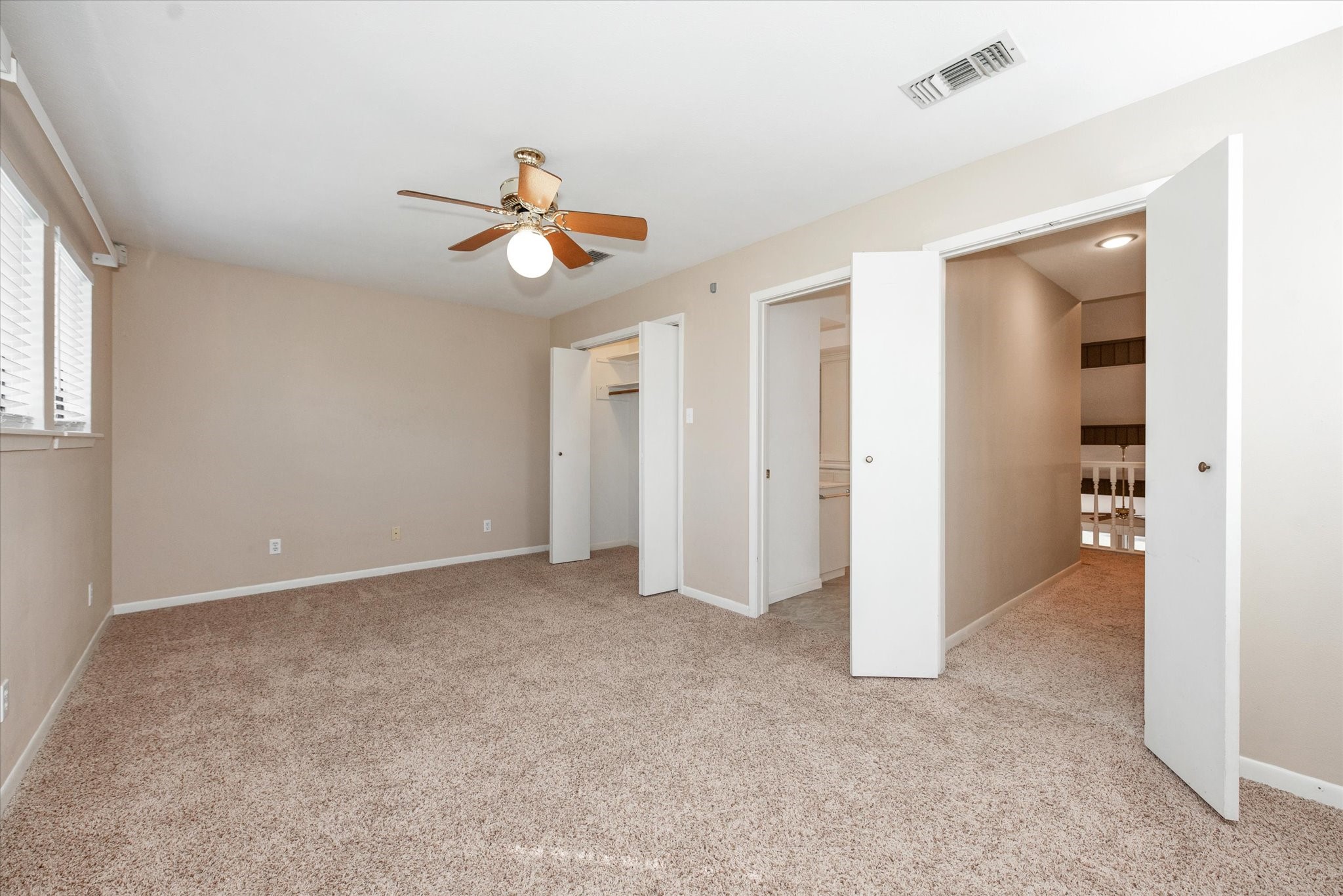 7 Hogan Lane Huntsville, TX 77340 - Photo 7 of 21 an empty room with closet and windows