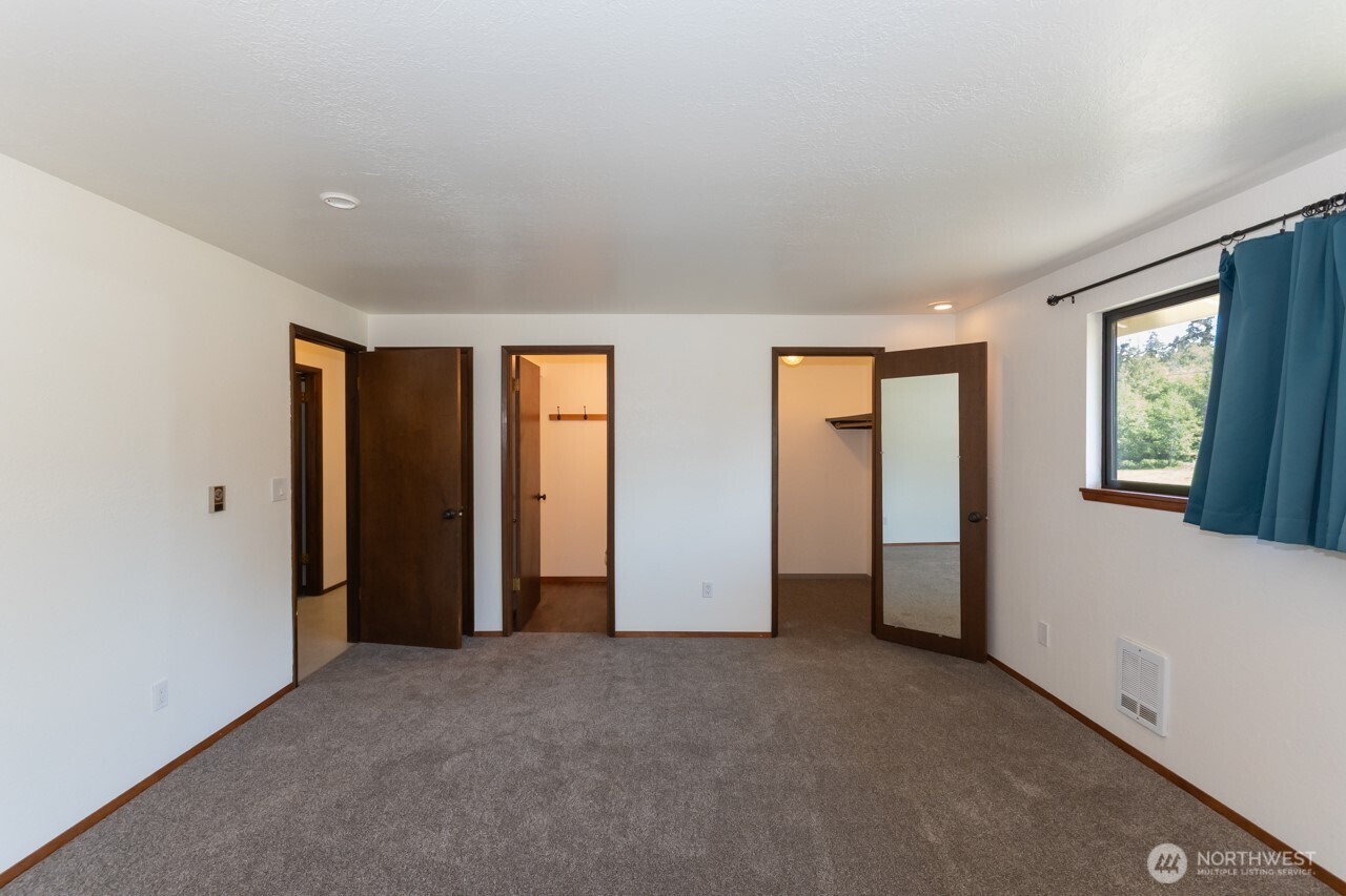 63 East Arnette Road Port Angeles, WA 98362 - Photo 27 of 40 a view of an empty room with window and closet area