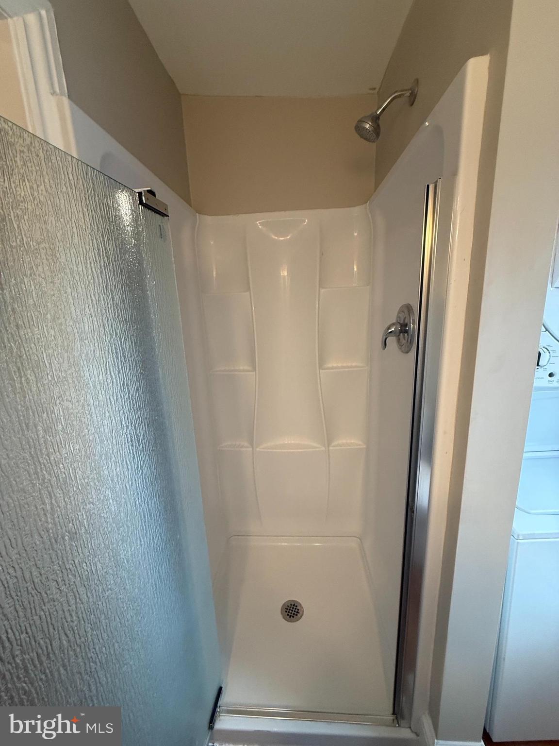 3 West Court Street, Unit 3 Doylestown, PA 18901 - Photo 11 of 12 a bathroom with a shower and a mirror