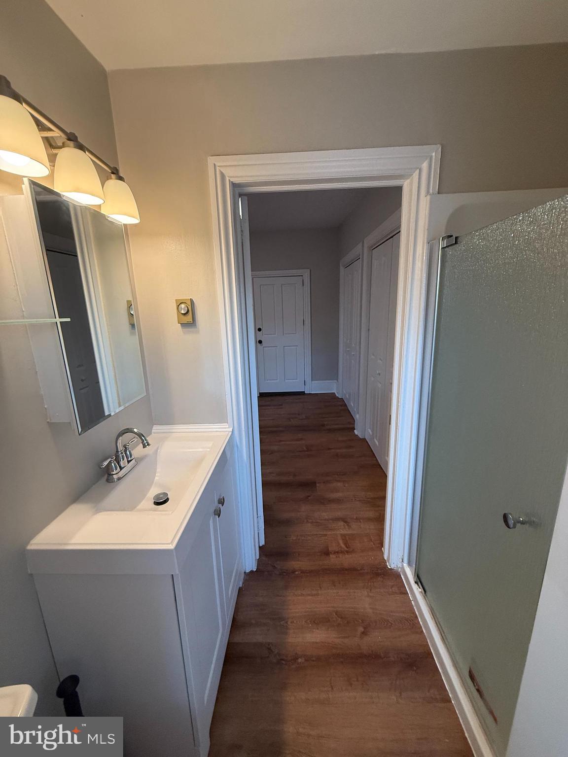 3 West Court Street, Unit 3 Doylestown, PA 18901 - Photo 10 of 12 a bathroom with a sink and mirror