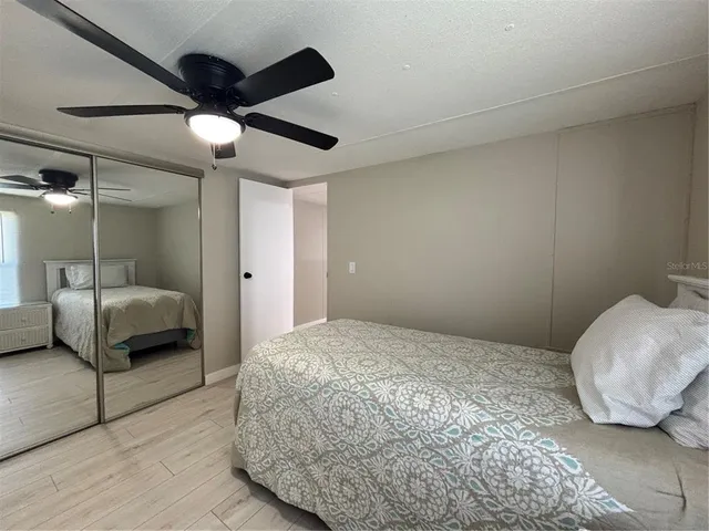 a bedroom with a bed and a couch