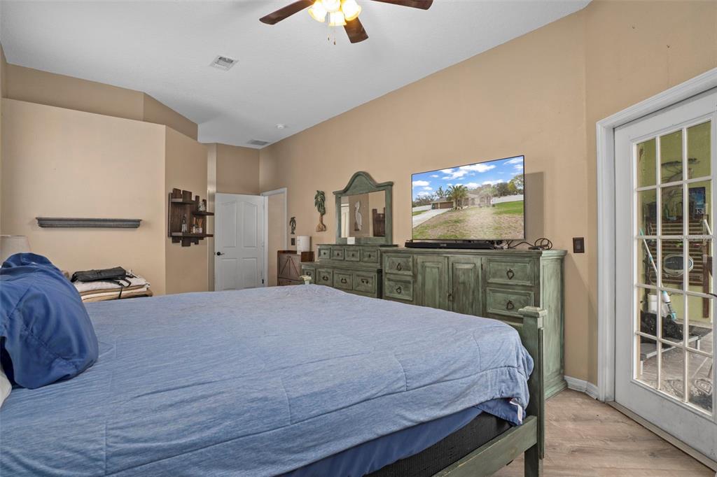 1378 Matthew Avenue Spring Hill, FL 34609 - Photo 19 of 56 a bed room with a bed and a television