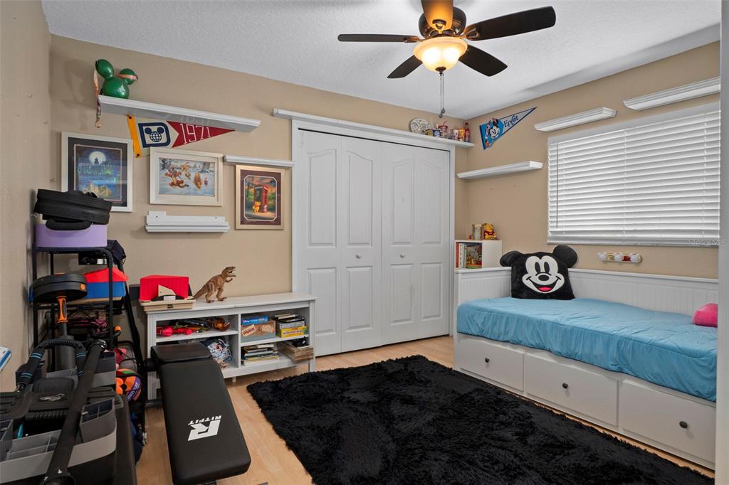 1378 Matthew Avenue Spring Hill, FL 34609 - Photo 23 of 56 a bedroom with furniture and a chandelier