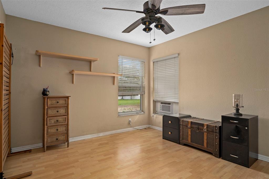 1378 Matthew Avenue Spring Hill, FL 34609 - Photo 26 of 56 a view of a bedroom with furniture and windows