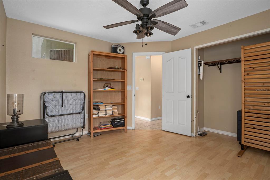 1378 Matthew Avenue Spring Hill, FL 34609 - Photo 27 of 56 a view of room with cabinet and a ceiling fan
