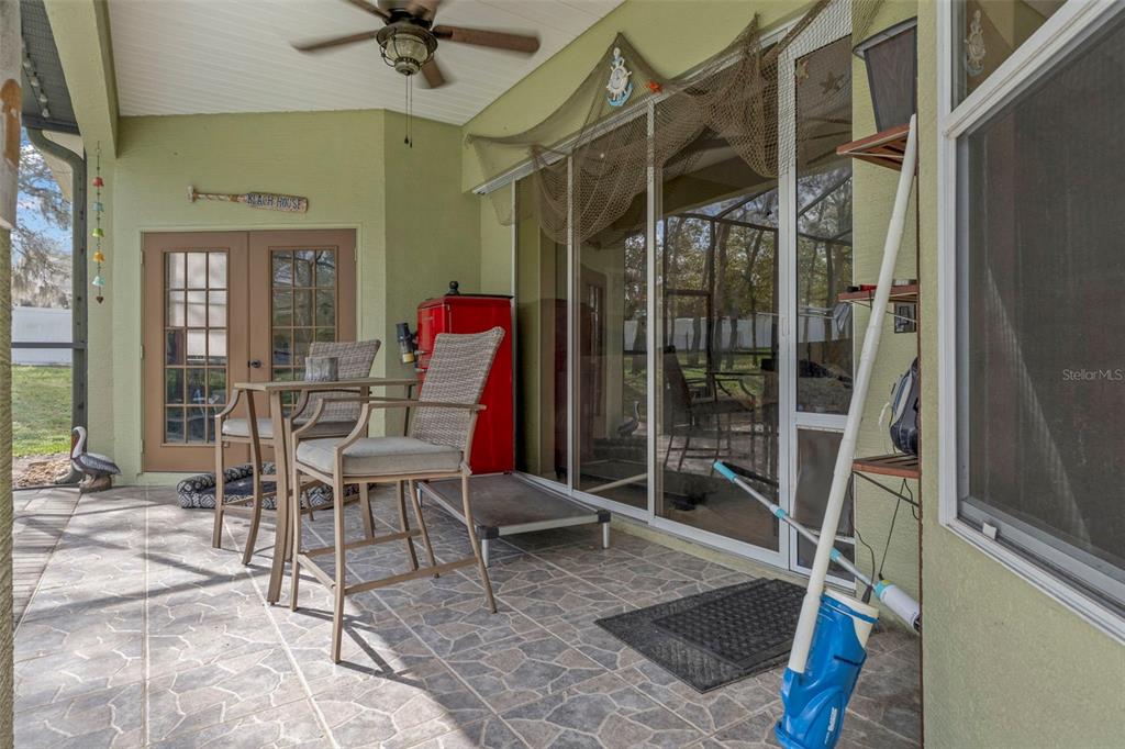 1378 Matthew Avenue Spring Hill, FL 34609 - Photo 28 of 56 a view of a hallway with a dining table and a chair