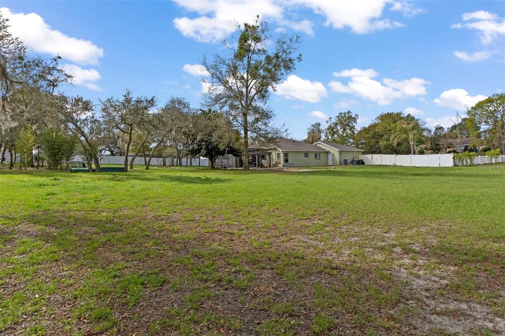 1378 Matthew Avenue Spring Hill, FL 34609 - Photo 44 of 56 a view of a grassy field with entertaining space