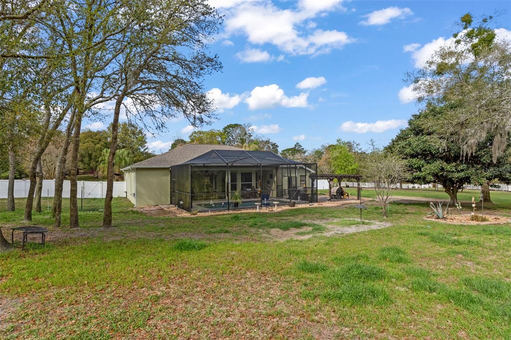 1378 Matthew Avenue Spring Hill, FL 34609 - Photo 46 of 56 a view of a house with a yard
