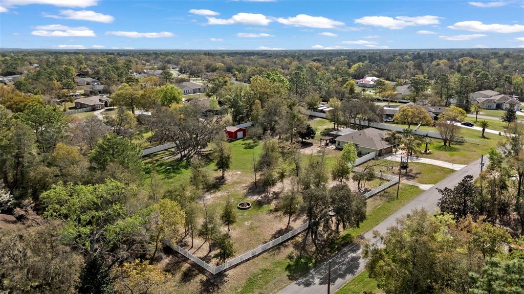 1378 Matthew Avenue Spring Hill, FL 34609 - Photo 51 of 56 an aerial view of residential houses with outdoor space and trees