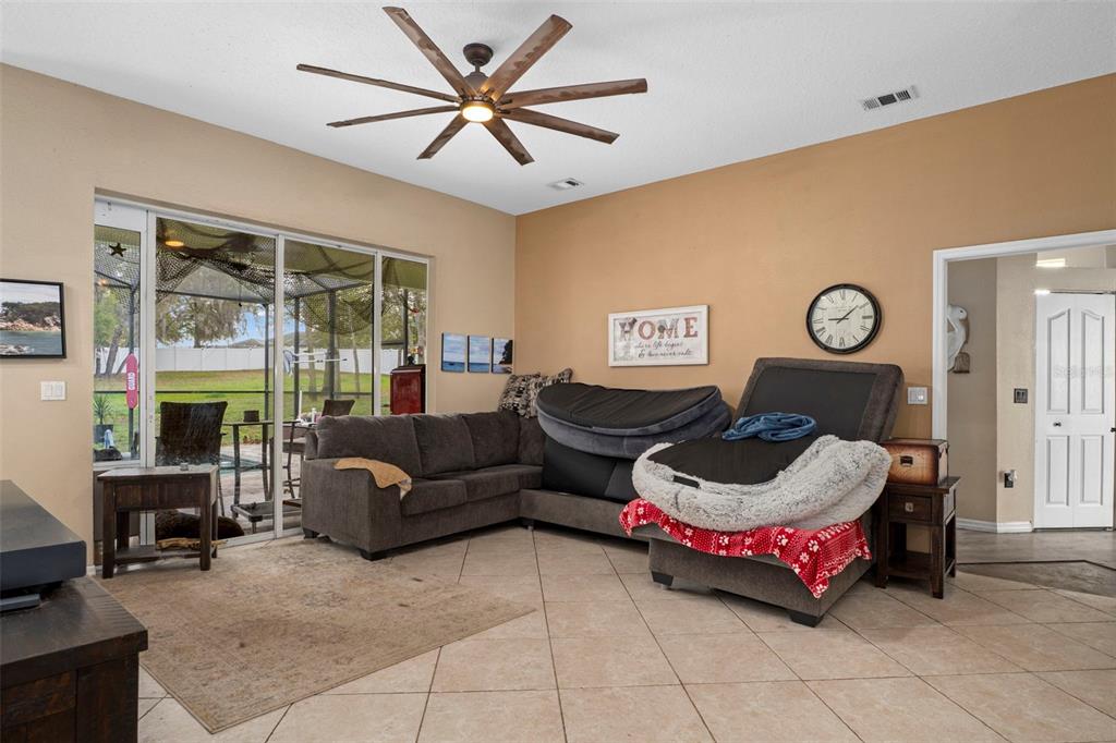 1378 Matthew Avenue Spring Hill, FL 34609 - Photo 8 of 56 a living room with furniture and a large window