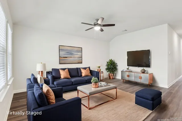 a living room with furniture and a flat screen tv