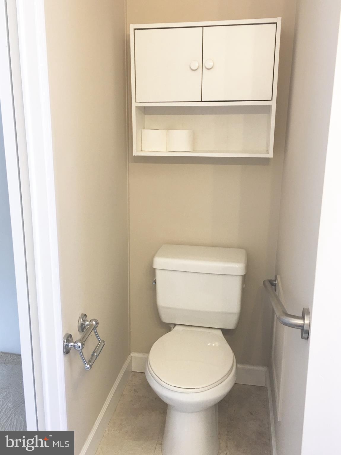 109 Rodeo Circle Middle River, MD 21220 - Photo 24 of 24 a white toilet sitting next to a bathroom sink