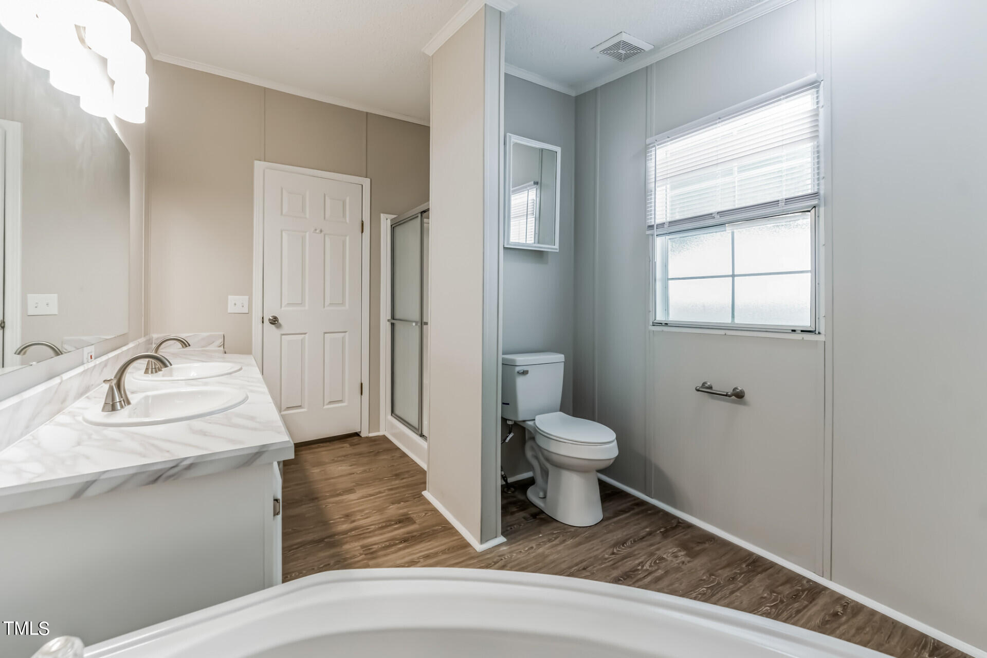 2416 Lucy Garrett Road Roxboro, NC 27574 - Photo 14 of 25 a bathroom with a sink toilet and vanity