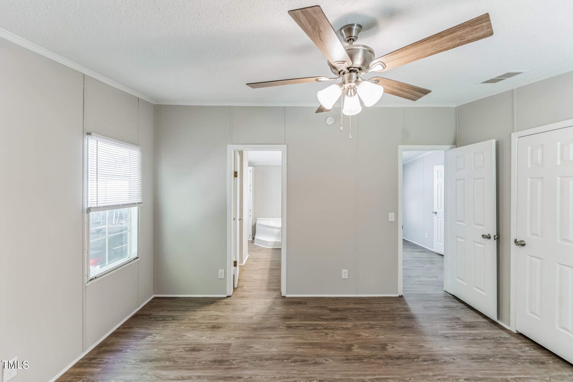 2416 Lucy Garrett Road Roxboro, NC 27574 - Photo 17 of 25 wooden floor in an empty room with a window