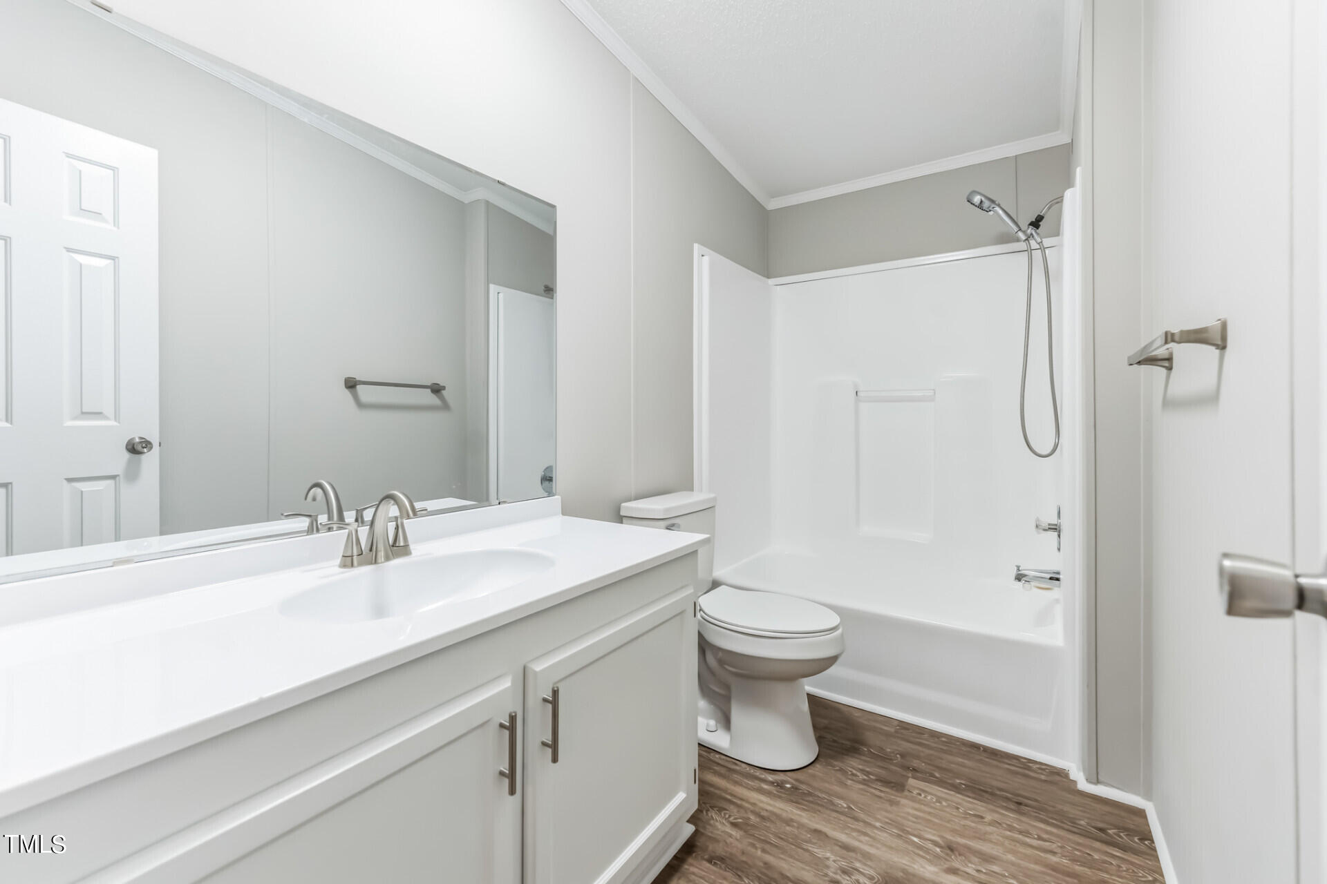 2416 Lucy Garrett Road Roxboro, NC 27574 - Photo 21 of 25 a bathroom with a sink toilet a shower and a mirror