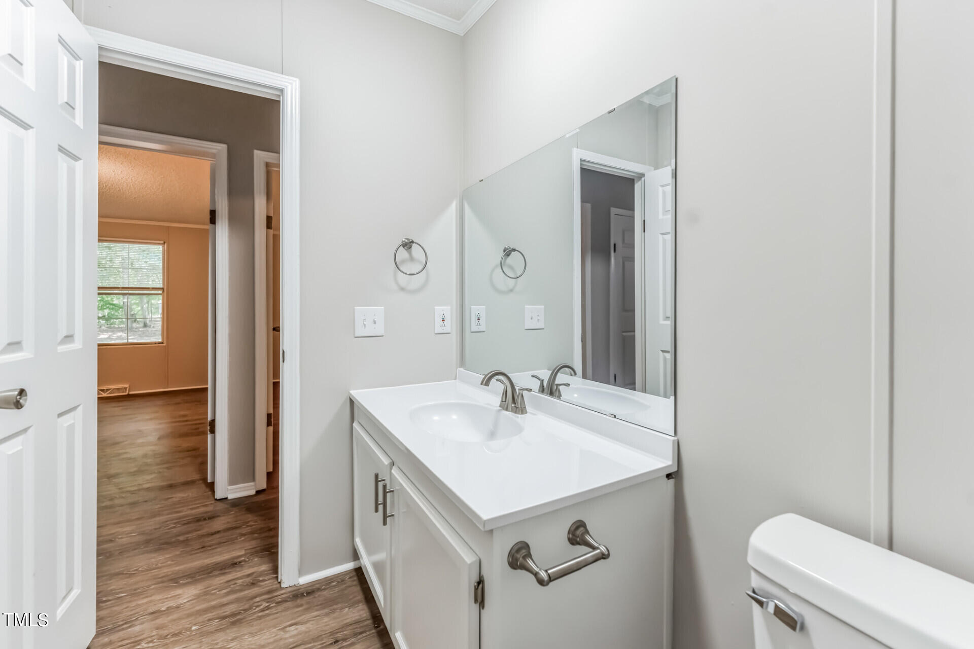 2416 Lucy Garrett Road Roxboro, NC 27574 - Photo 23 of 25 a bathroom with a sink toilet and mirror