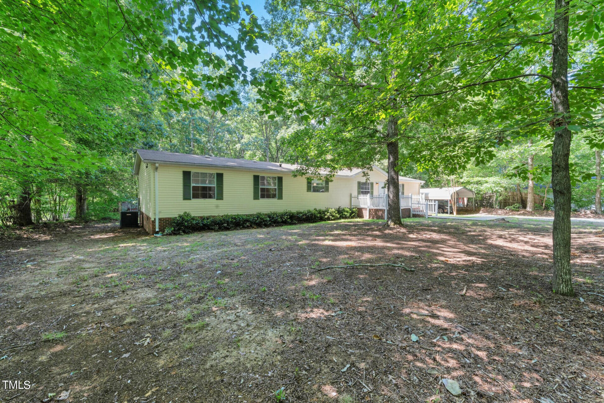 2416 Lucy Garrett Road Roxboro, NC 27574 - Photo 5 of 25 a view of a house with yard and tree s