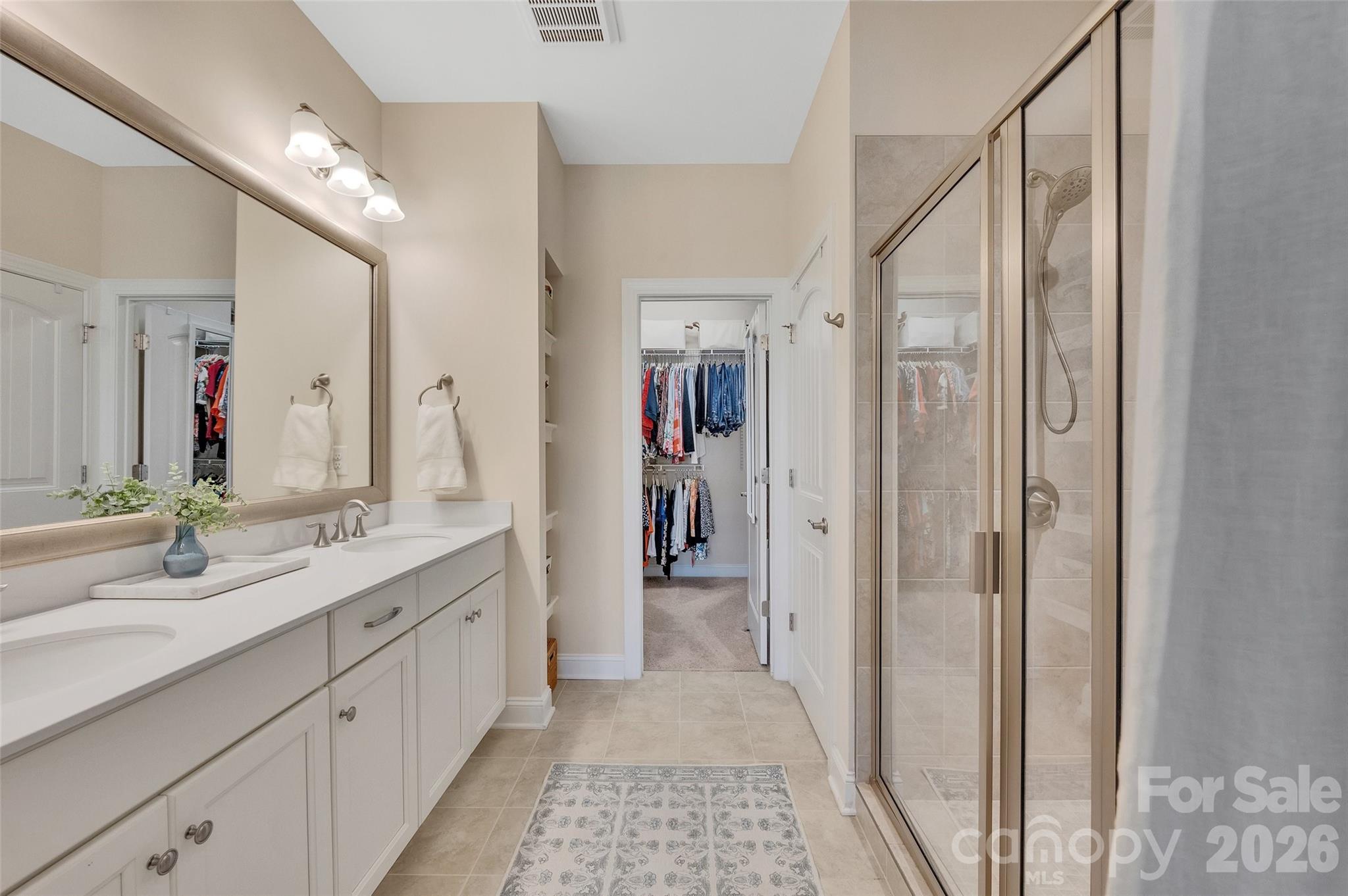 6243 Scuttle Lane Denver, NC 28037 - Photo 17 of 34 a bathroom with a double vanity sink and a mirror