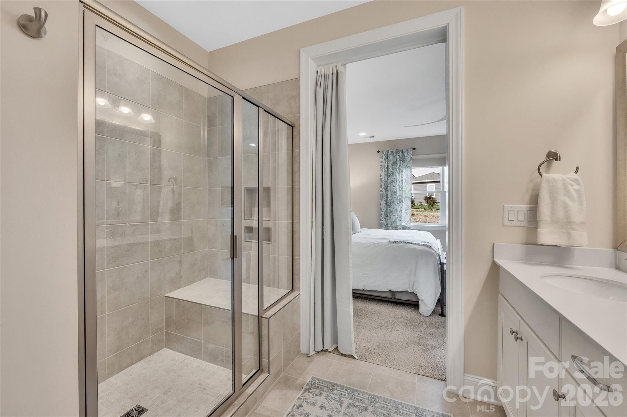 6243 Scuttle Lane Denver, NC 28037 - Photo 19 of 34 a bathroom with a tub shower and sink