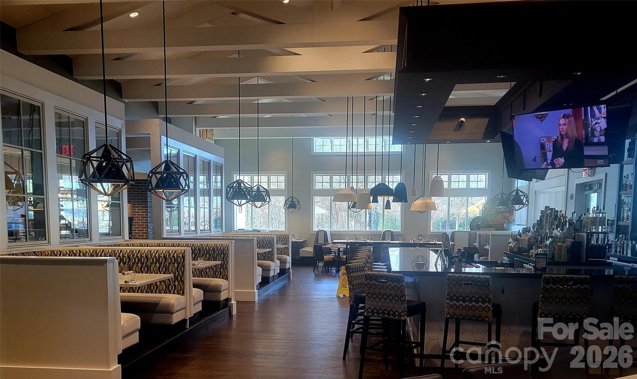 6243 Scuttle Lane Denver, NC 28037 - Photo 31 of 34 a room with lots of wooden furniture and a chandelier