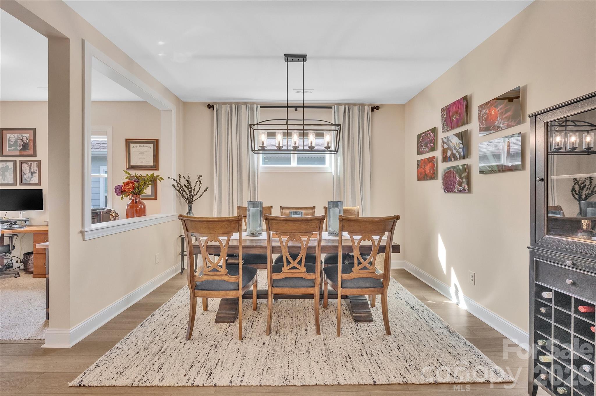 6243 Scuttle Lane Denver, NC 28037 - Photo 6 of 34 a view of a dining room with furniture window and wooden floor