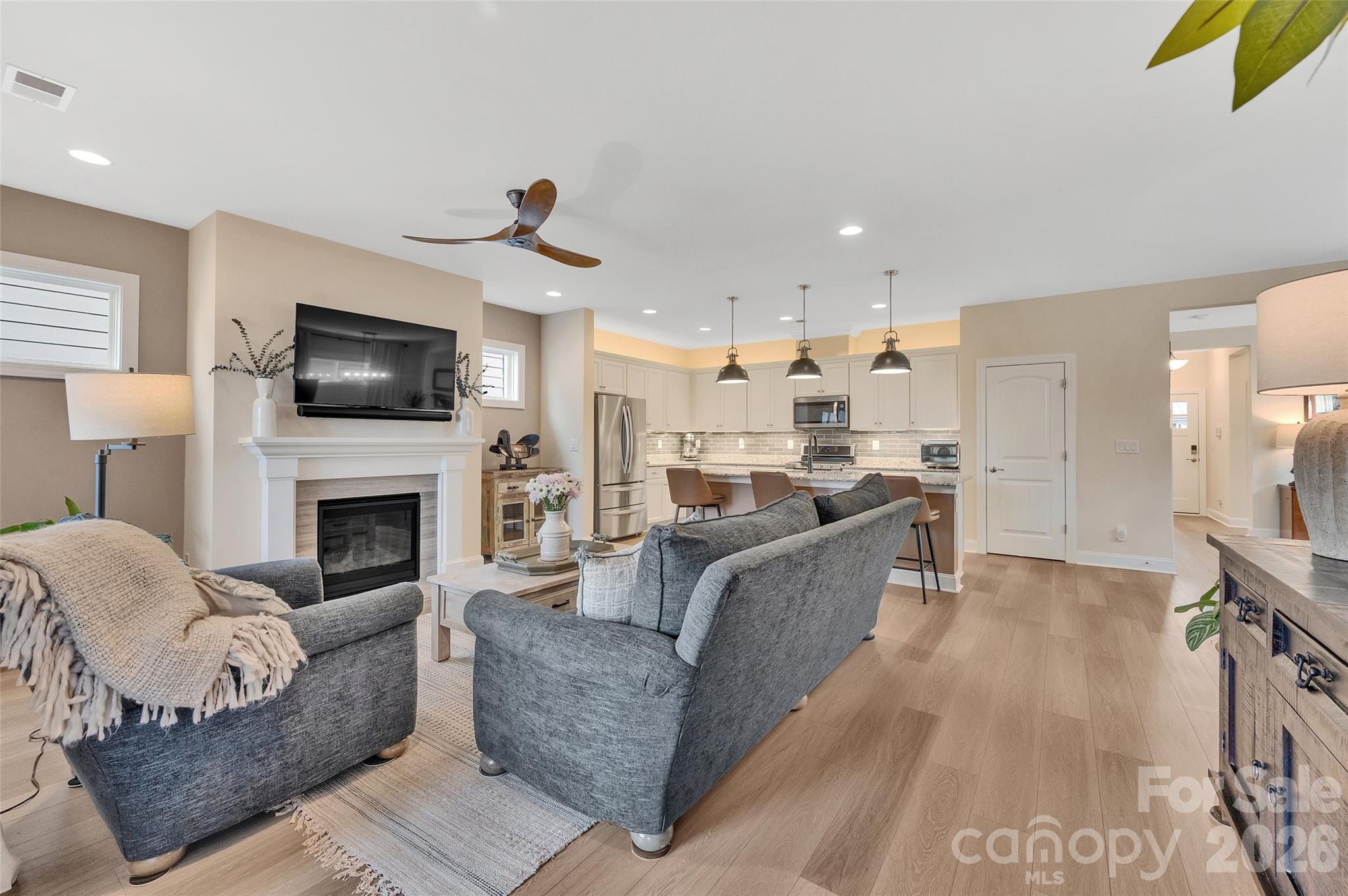 6243 Scuttle Lane Denver, NC 28037 - Photo 8 of 34 a living room with furniture fireplace and flat screen tv
