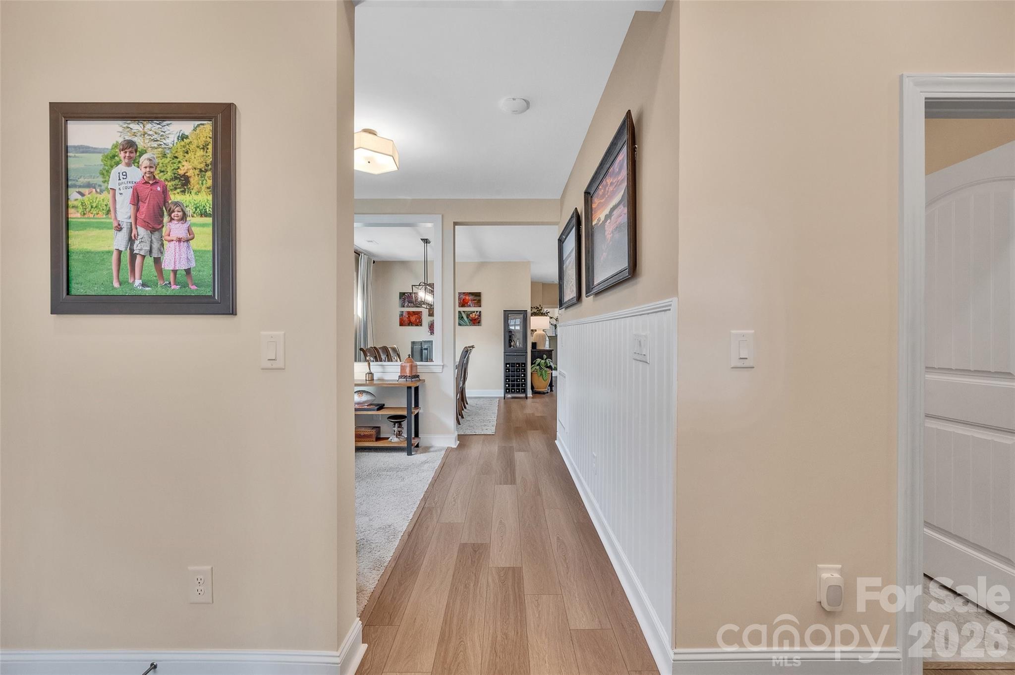 6243 Scuttle Lane Denver, NC 28037 - Photo 10 of 34 a view of a hallway with wooden floor and staircase