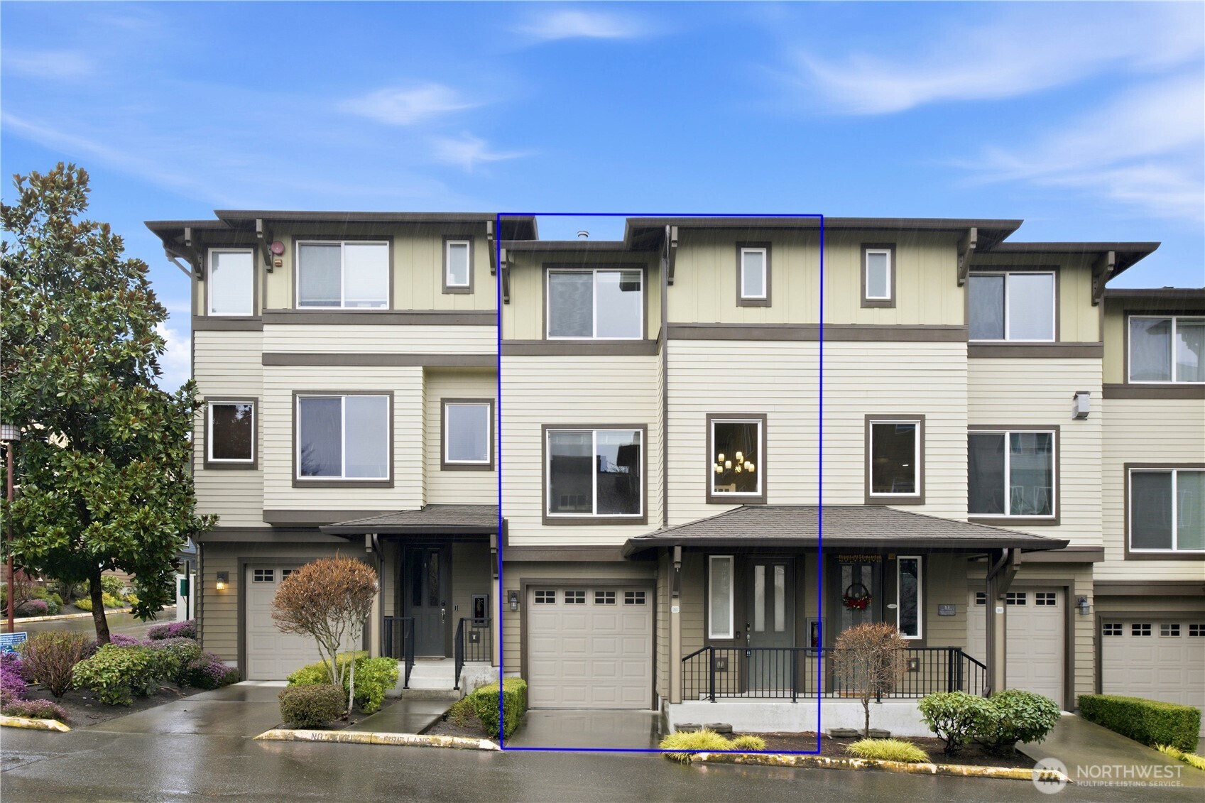 2115 201st Place Southeast, Unit B2 Bothell, WA 98012 - Photo 3 of 24 a front view of a building with street view