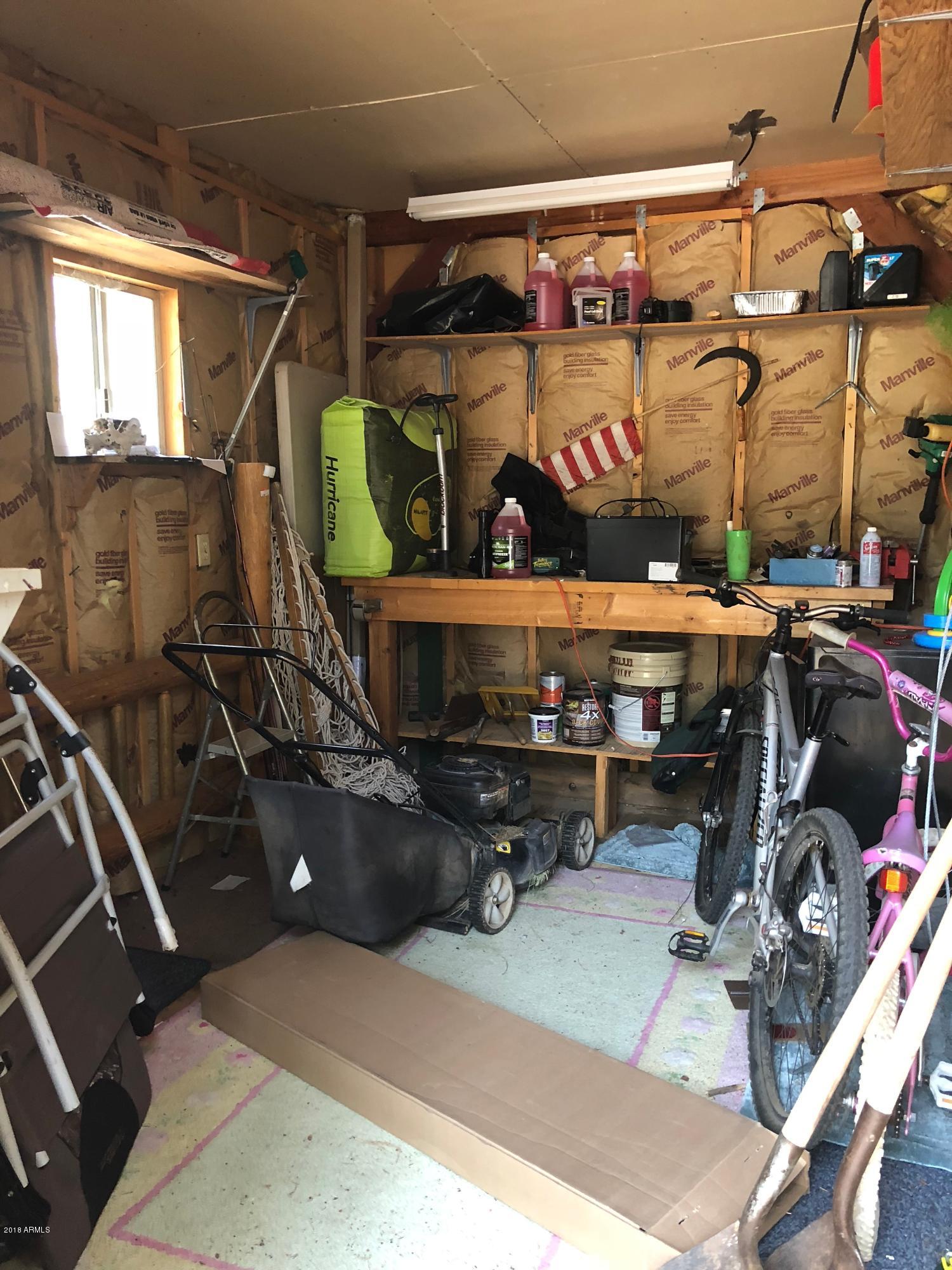 2865 Cattle Trail Road Overgaard, AZ 85933 - Photo 24 of 28 a view of storage and utility room