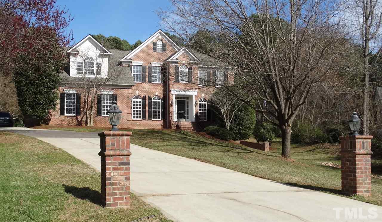 10404 Veasey Mill Road Raleigh, NC 27615 - Photo 1 of 30 a front view of a house with a yard and large tree