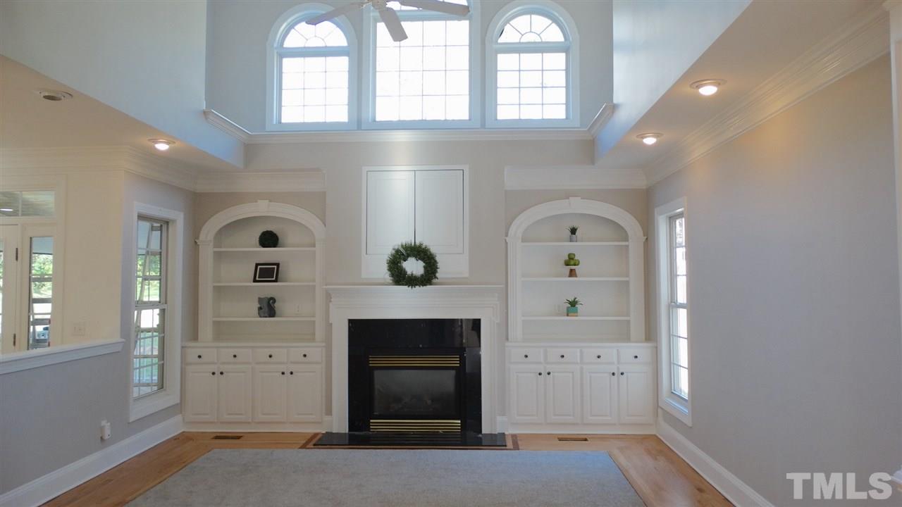 10404 Veasey Mill Road Raleigh, NC 27615 - Photo 2 of 30 wooden floor in an empty room with a window