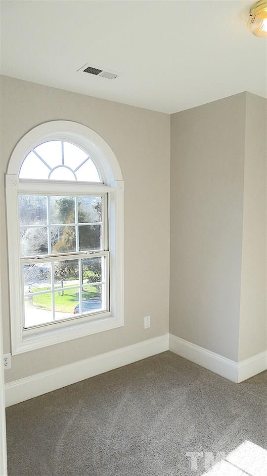 10404 Veasey Mill Road Raleigh, NC 27615 - Photo 14 of 30 an empty room with a window