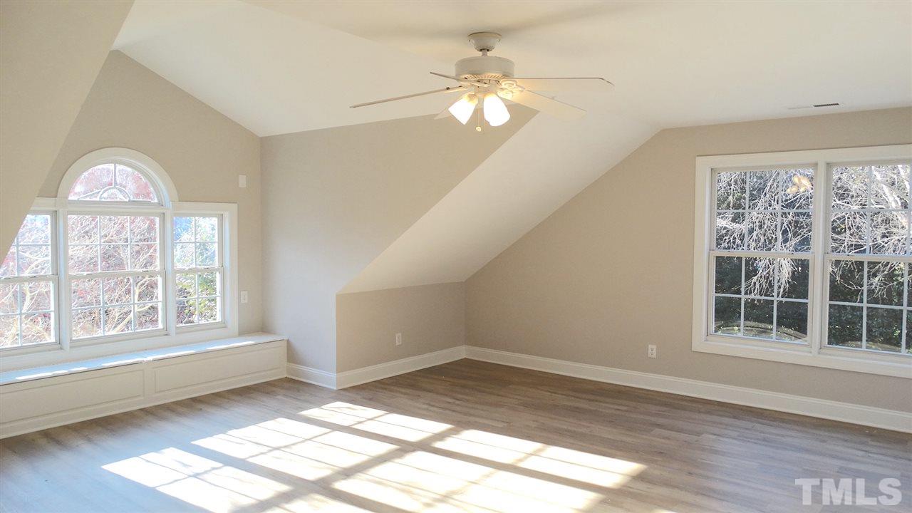 10404 Veasey Mill Road Raleigh, NC 27615 - Photo 15 of 30 wooden floor in an empty room with a window